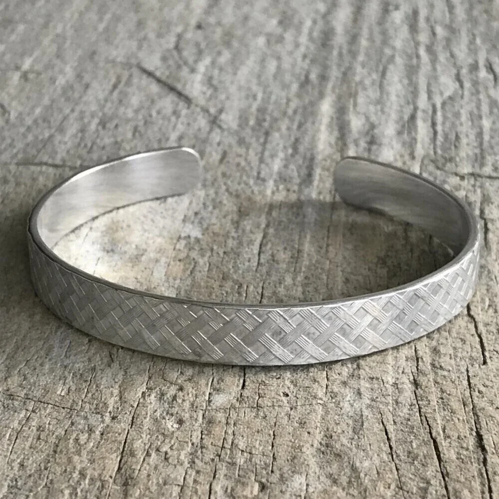Brushed sterling silver woven tartan plaid pattern open cuff bangle bracelet.